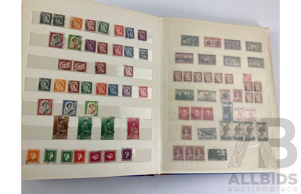 Two Albums of Vintage Stamps Including New Zealand, Dubai, Mongolia, Poland, Cocos Islands, Zimbabwe, Singapore, Canada, Yugoslavia, USA, Netherlands, UK, Fiji, France, PNG, Grenada, Isle of Men