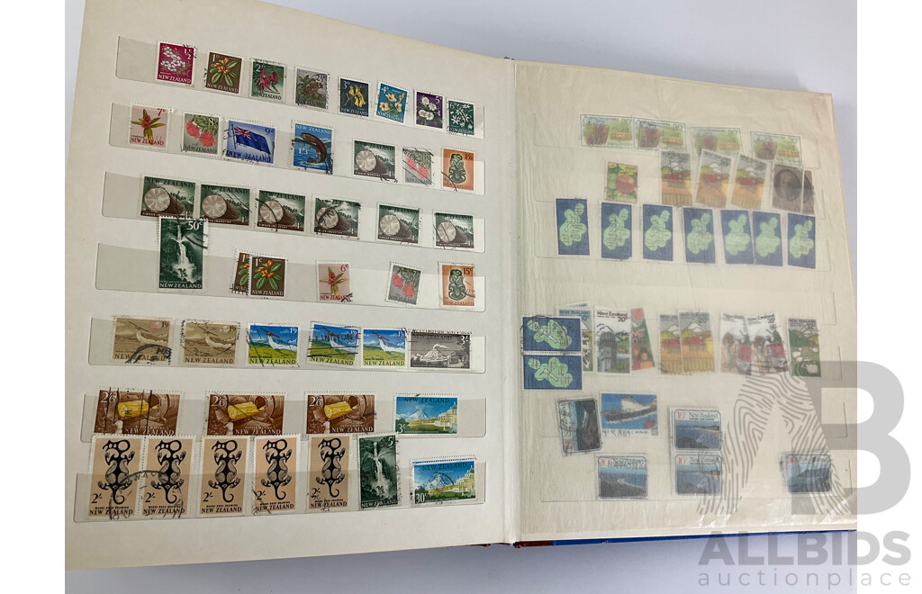 Two Albums of Vintage Stamps Including New Zealand, Dubai, Mongolia, Poland, Cocos Islands, Zimbabwe, Singapore, Canada, Yugoslavia, USA, Netherlands, UK, Fiji, France, PNG, Grenada, Isle of Men
