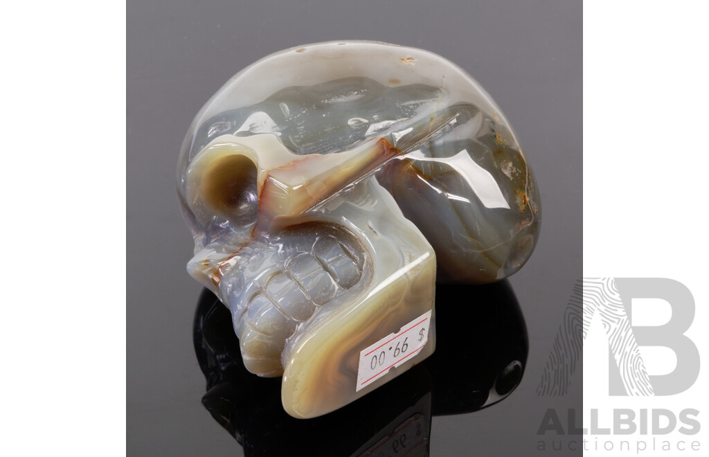 Carved Polished Banded Agate Stone Memento Mori Half Skull with Crystal Cave to One Side