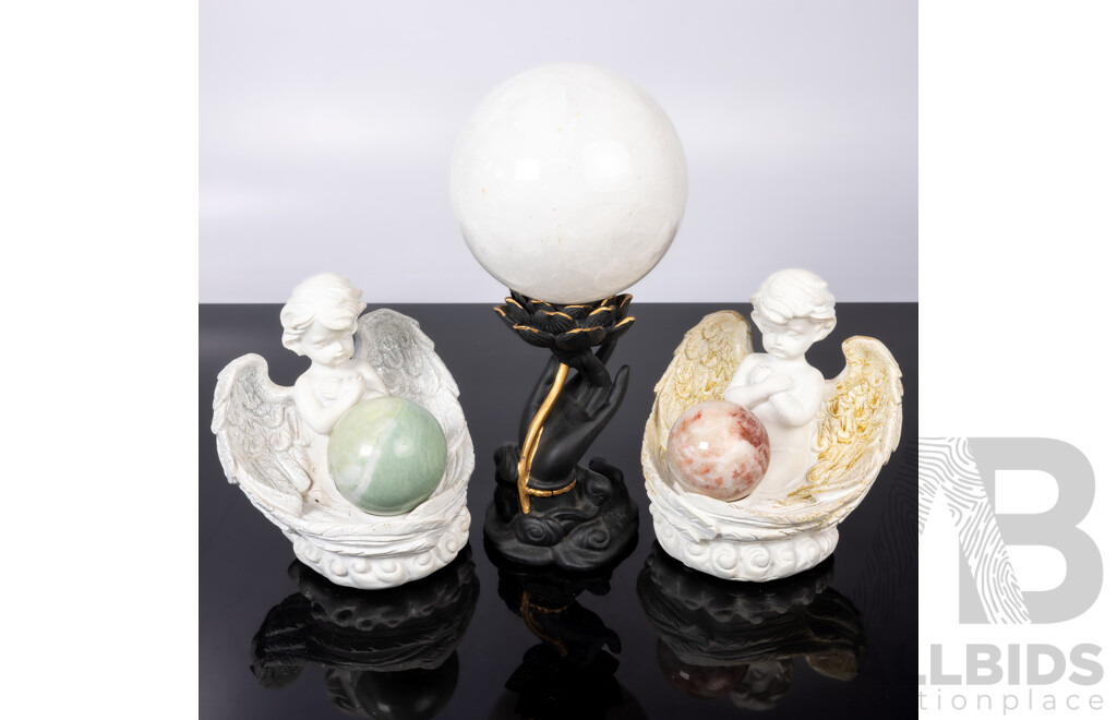 Collection Carved Stone Spheres on Composite Stands Including Pair Angels and Large White Quartz Sphere