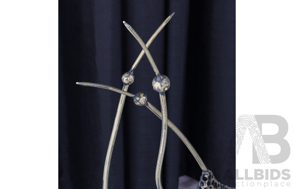 Set of Four Metal Stork Figures