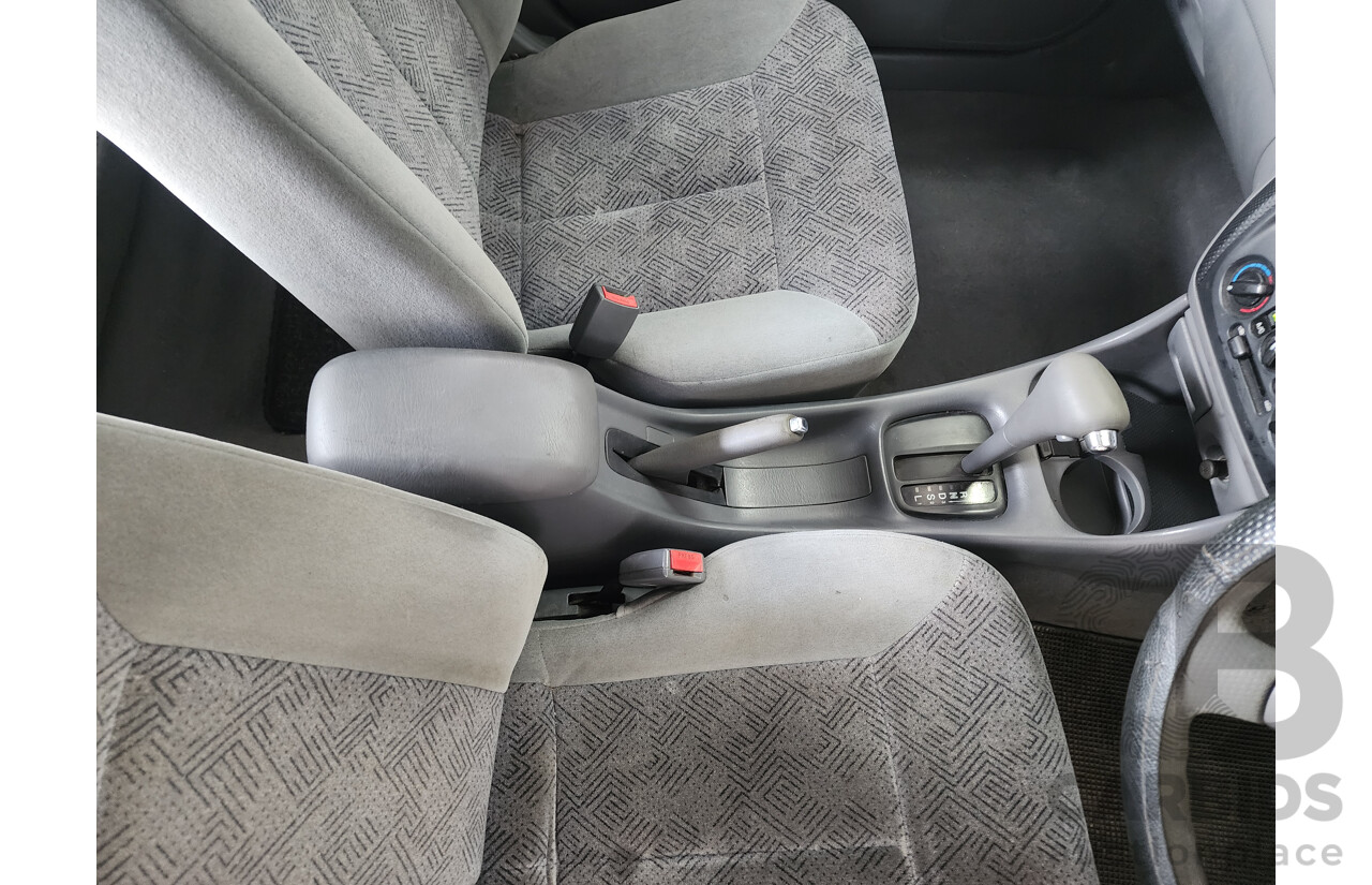 12/1999 Ford Laser LXi KJIII 4d Sedan White 1.6L