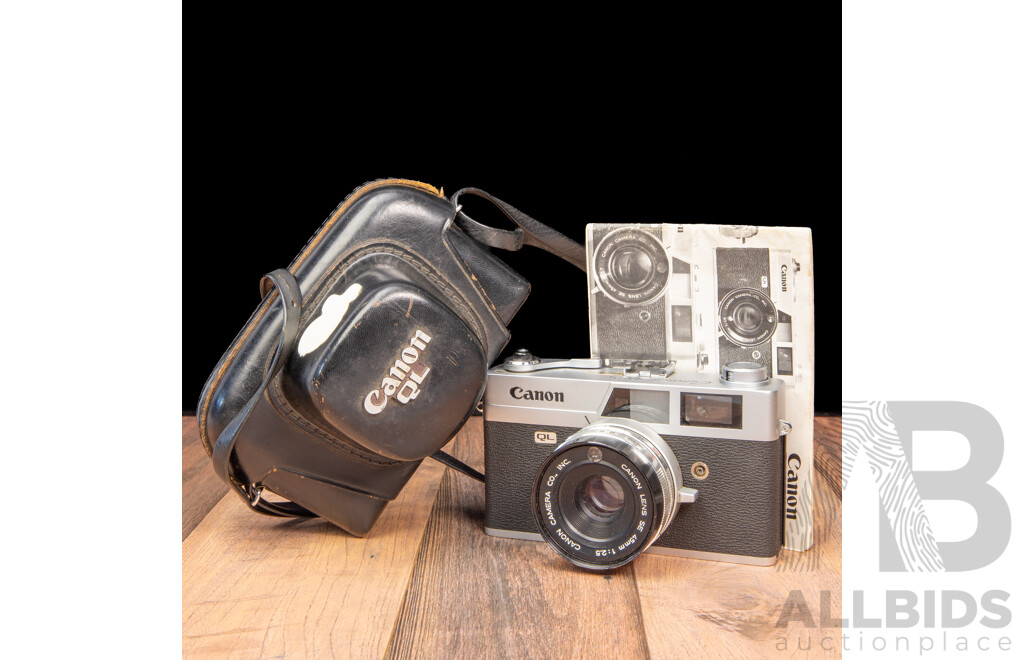 Vintage Canon QL 35mm Film Camera with Leather Case and Instruction Manual