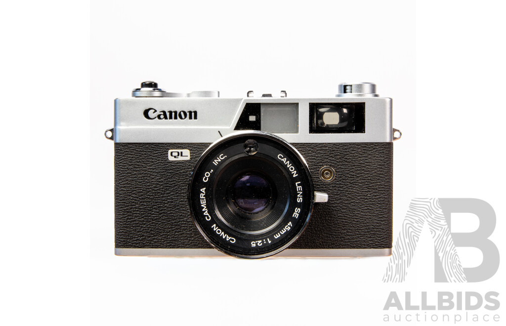 Vintage Canon QL 35mm Film Camera with Leather Case and Instruction Manual