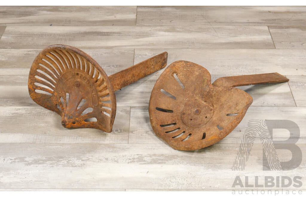 Two Antique Tractor Seats Including The Mitchell Cast Iron and Pressed Steel Example