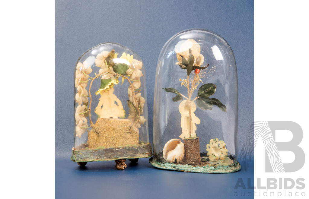 Two Victorian Glass Dome Floral and Wax Carved Figures