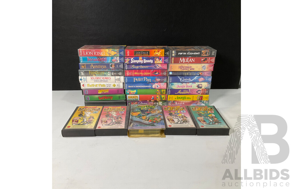 Box of Vintage VHS Cassette Tapes Including Looney Tunes, Disney, Smurfs, Ninja Turtles and More