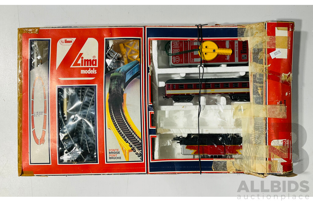Two Boxed Lima HO Scale Battery Operated Train Sets, Steam Locomotive and French Diesel in Original Packaging