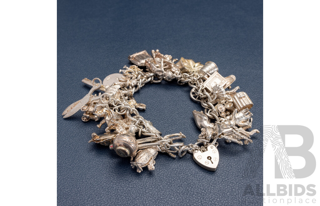 Sterling Silver Vintage Heart Padlock Bracelet with (39) Vintage Sterling Silver Charms, 101.0 Grams