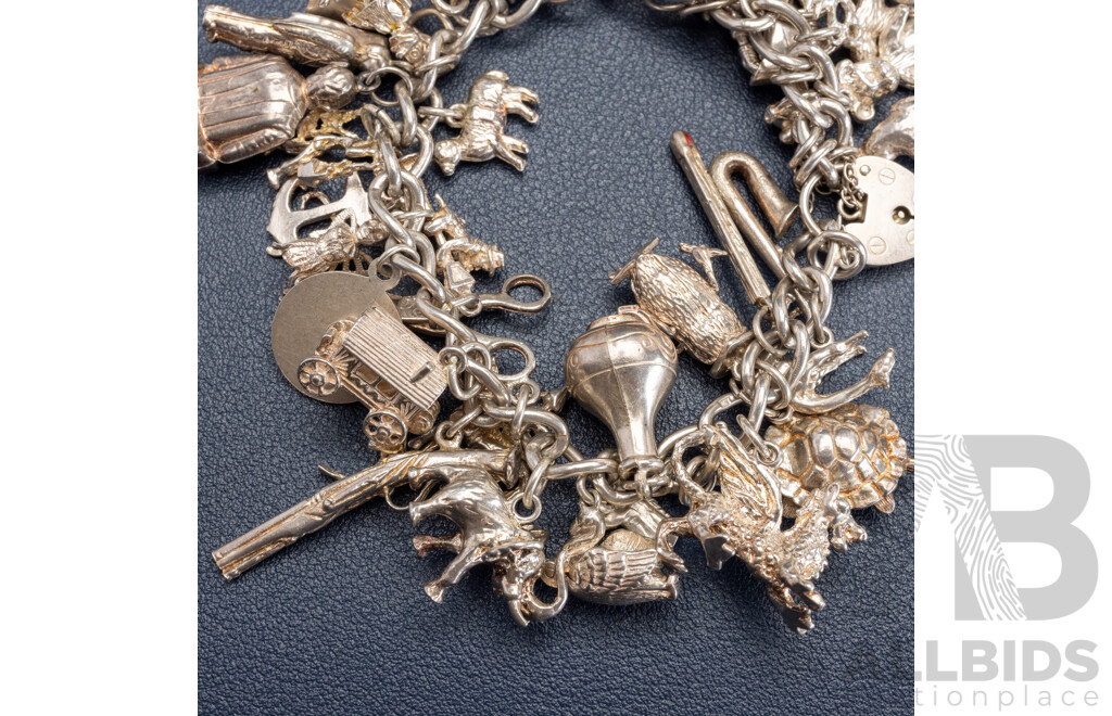 Sterling Silver Vintage Heart Padlock Bracelet with (39) Vintage Sterling Silver Charms, 101.0 Grams