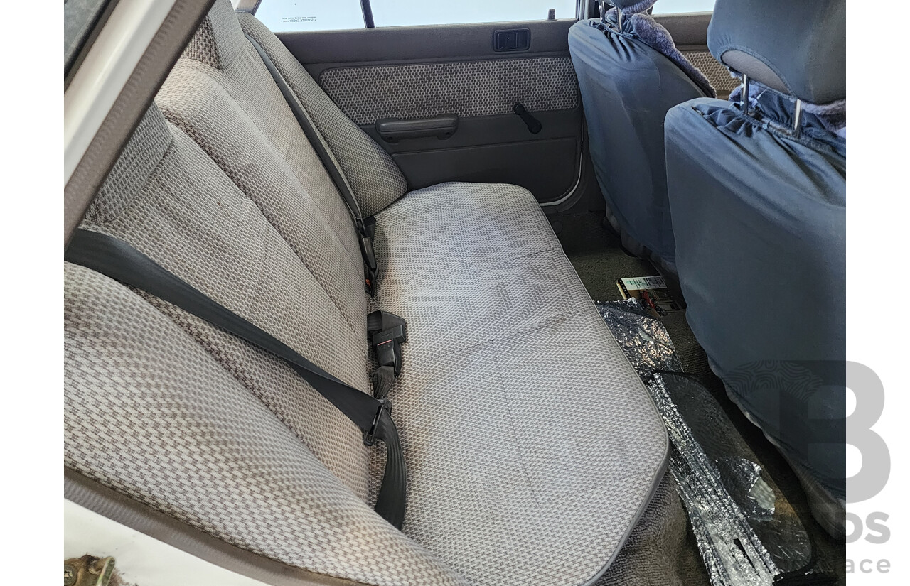 2/1991 Ford Laser GL KF 4d Sedan White 1.6L