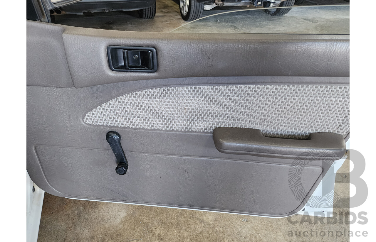 2/1991 Ford Laser GL KF 4d Sedan White 1.6L