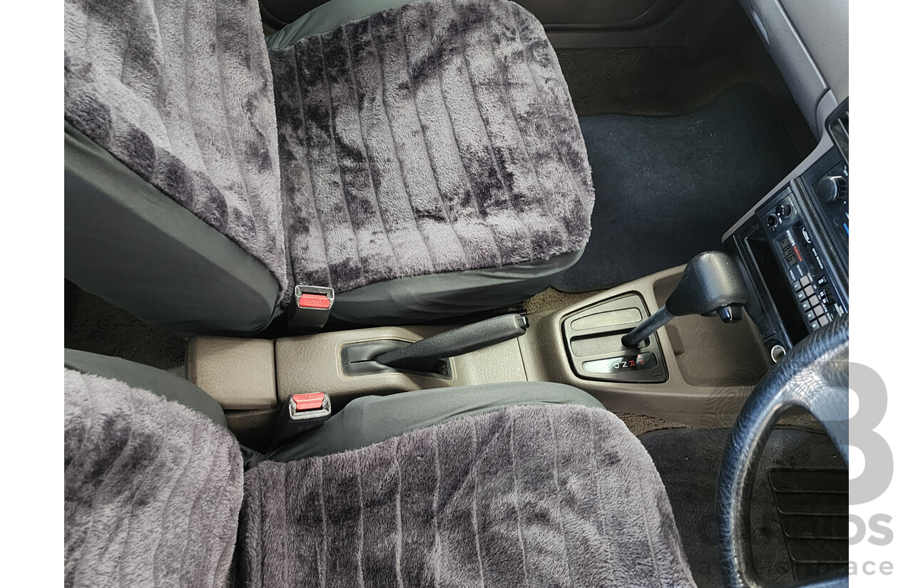 2/1991 Ford Laser GL KF 4d Sedan White 1.6L