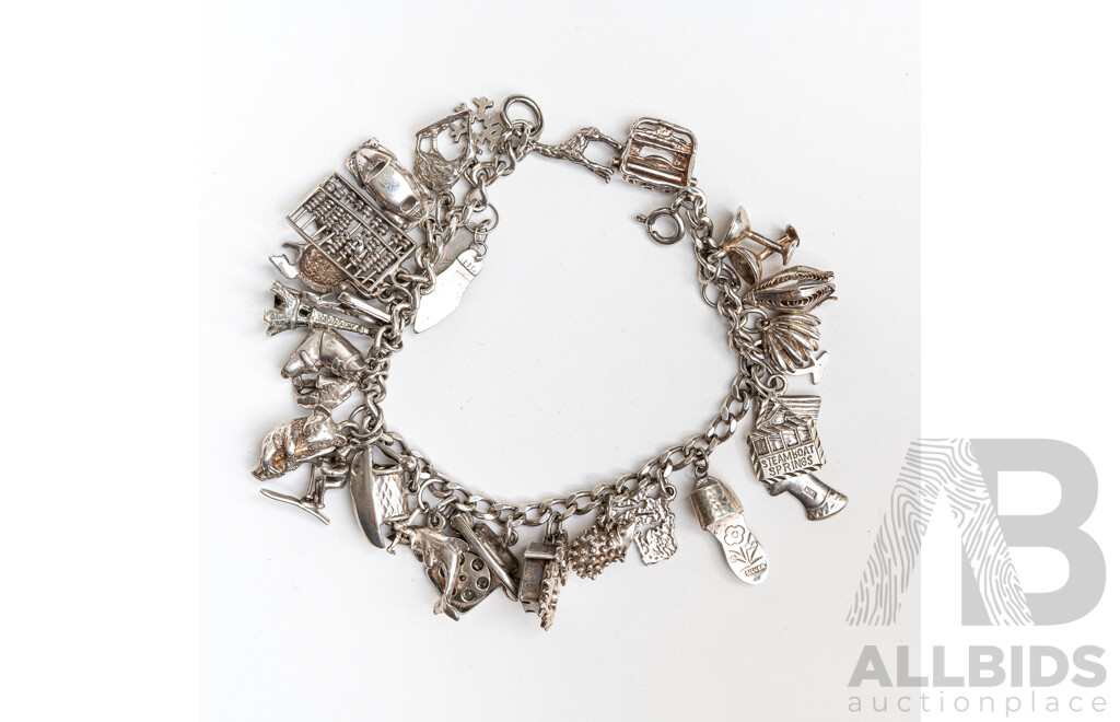 Sterling Silver Vintage Bracelet with (27) Vintage Charms, 19cm, 56.37 Grams