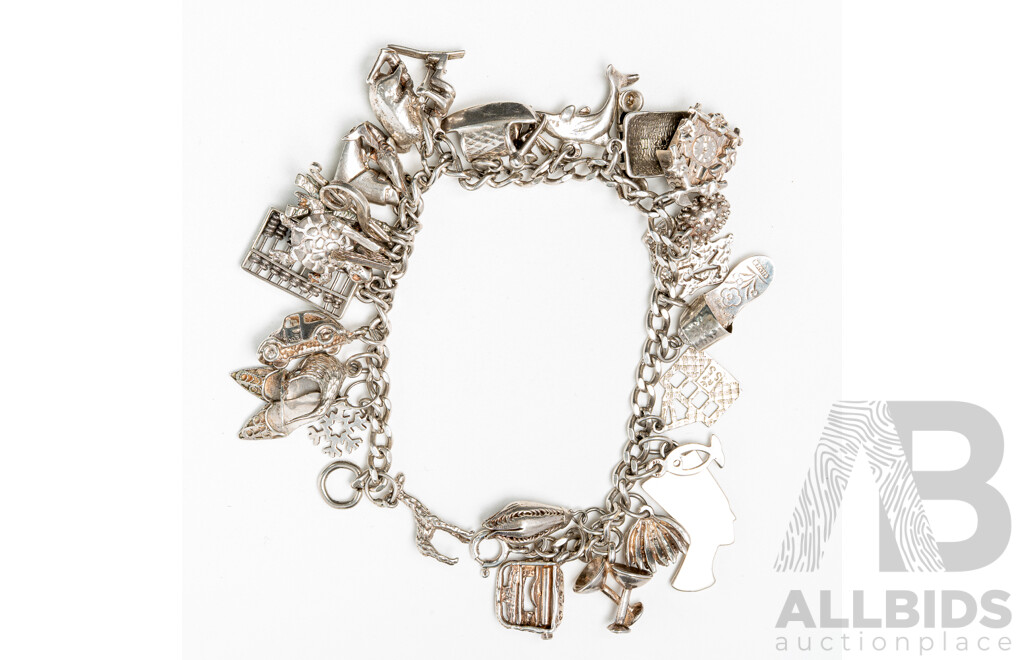 Sterling Silver Vintage Bracelet with (27) Vintage Charms, 19cm, 56.37 Grams