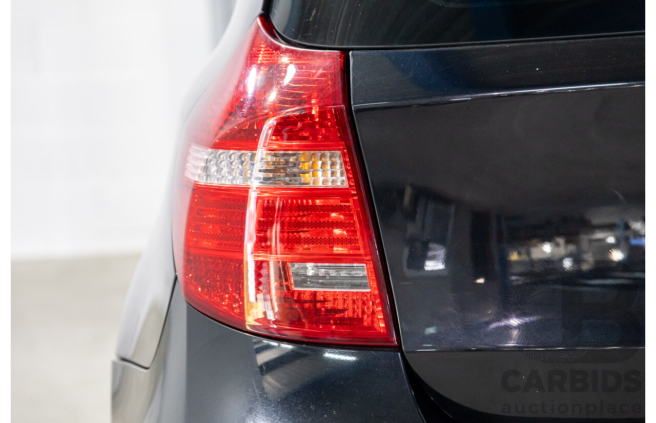 2/2009 BMW 120i E87 MY09 5d Hatchback Jet Black 2.0L