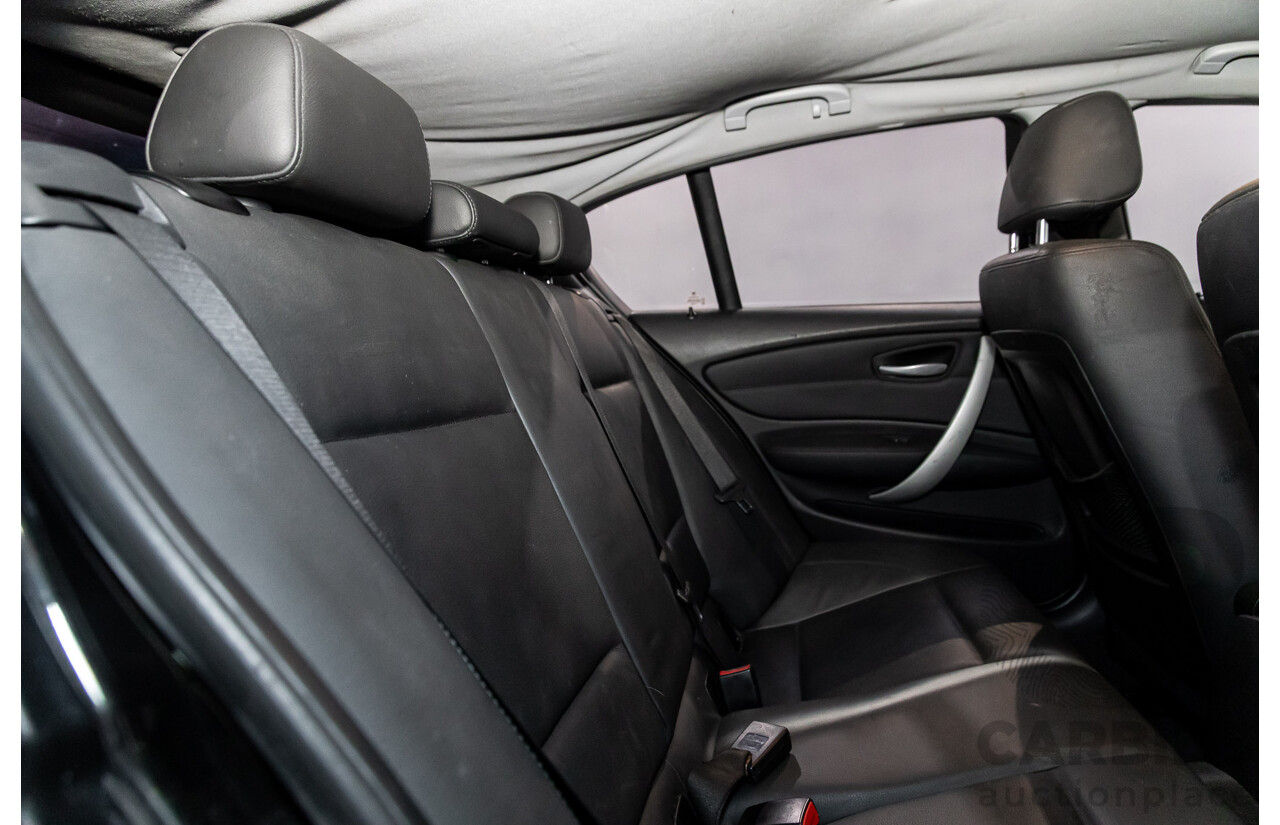 2/2009 BMW 120i E87 MY09 5d Hatchback Jet Black 2.0L