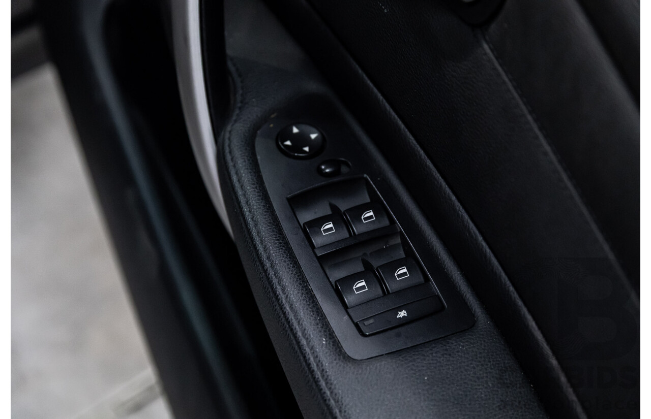 2/2009 BMW 120i E87 MY09 5d Hatchback Jet Black 2.0L