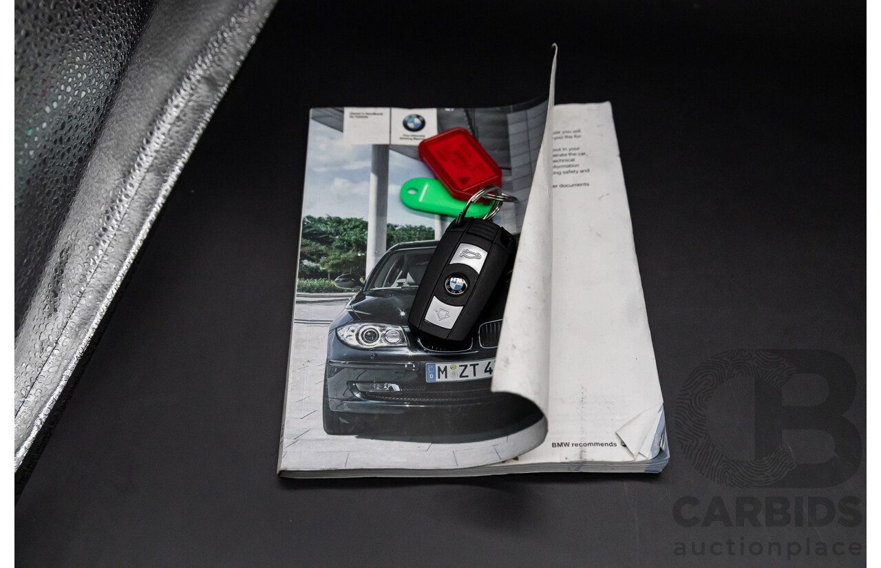 2/2009 BMW 120i E87 MY09 5d Hatchback Jet Black 2.0L