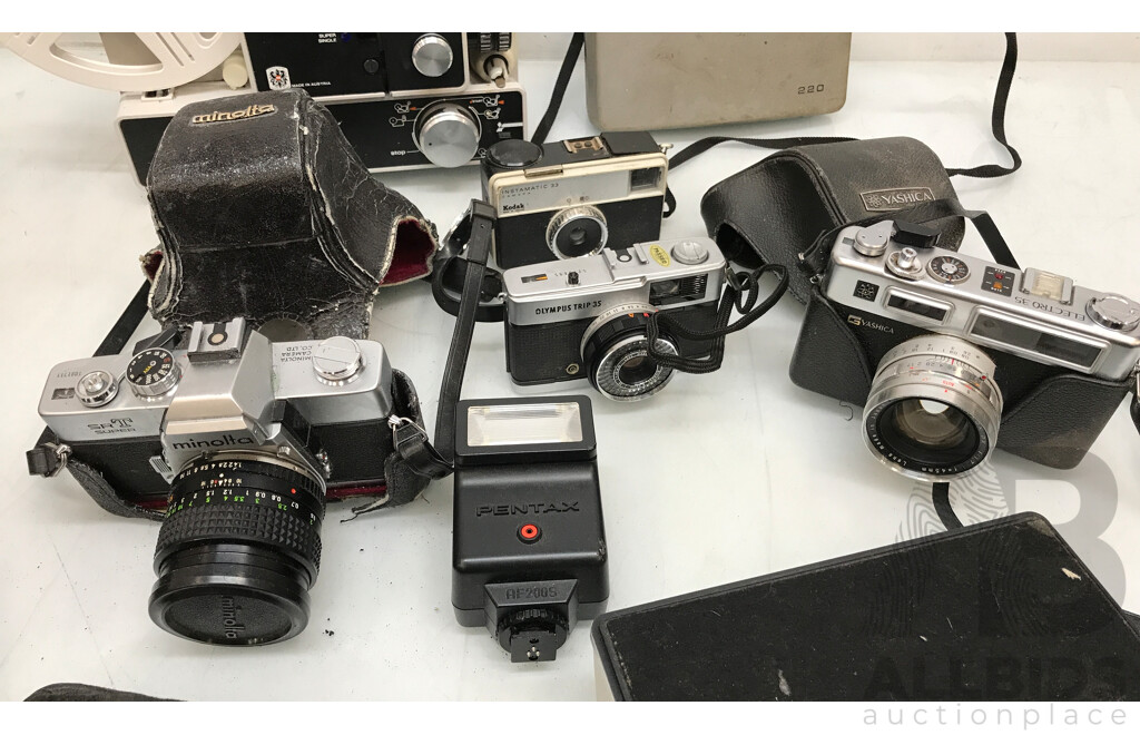Assorted Vintage Photography and Media Equipment Including Cameras, Tripods, and Projector
