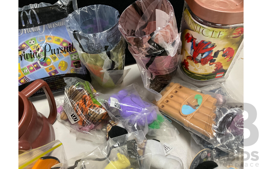 Assortment of Fast Food Meal Toys in Original Packaging, Astro Boy, Simpsons Tazos, Lego Bionicle, Yowie Adventure Series Two, Care Bears, Display Figures and More