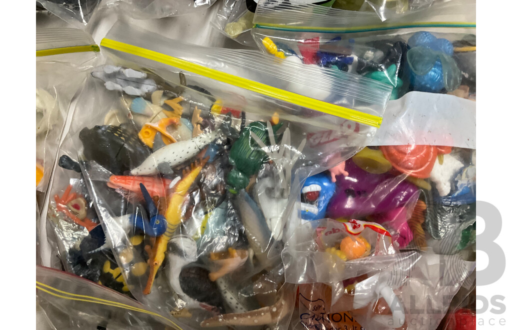Assortment of Fast Food Meal Toys in Original Packaging, Astro Boy, Simpsons Tazos, Lego Bionicle, Yowie Adventure Series Two, Care Bears, Display Figures and More