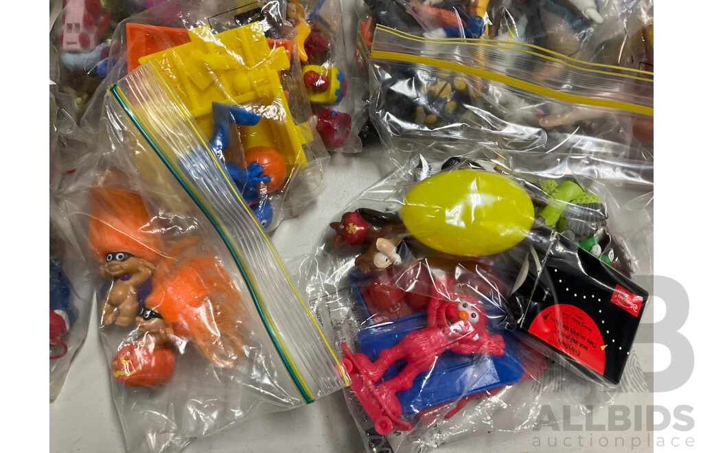 Assortment of Fast Food Meal Toys in Original Packaging, Astro Boy, Simpsons Tazos, Lego Bionicle, Yowie Adventure Series Two, Care Bears, Display Figures and More