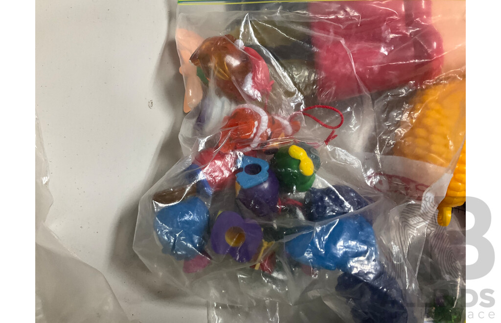Assortment of Fast Food Meal Toys in Original Packaging, Astro Boy, Simpsons Tazos, Lego Bionicle, Yowie Adventure Series Two, Care Bears, Display Figures and More