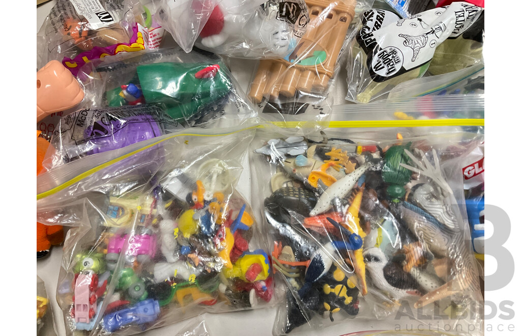 Assortment of Fast Food Meal Toys in Original Packaging, Astro Boy, Simpsons Tazos, Lego Bionicle, Yowie Adventure Series Two, Care Bears, Display Figures and More