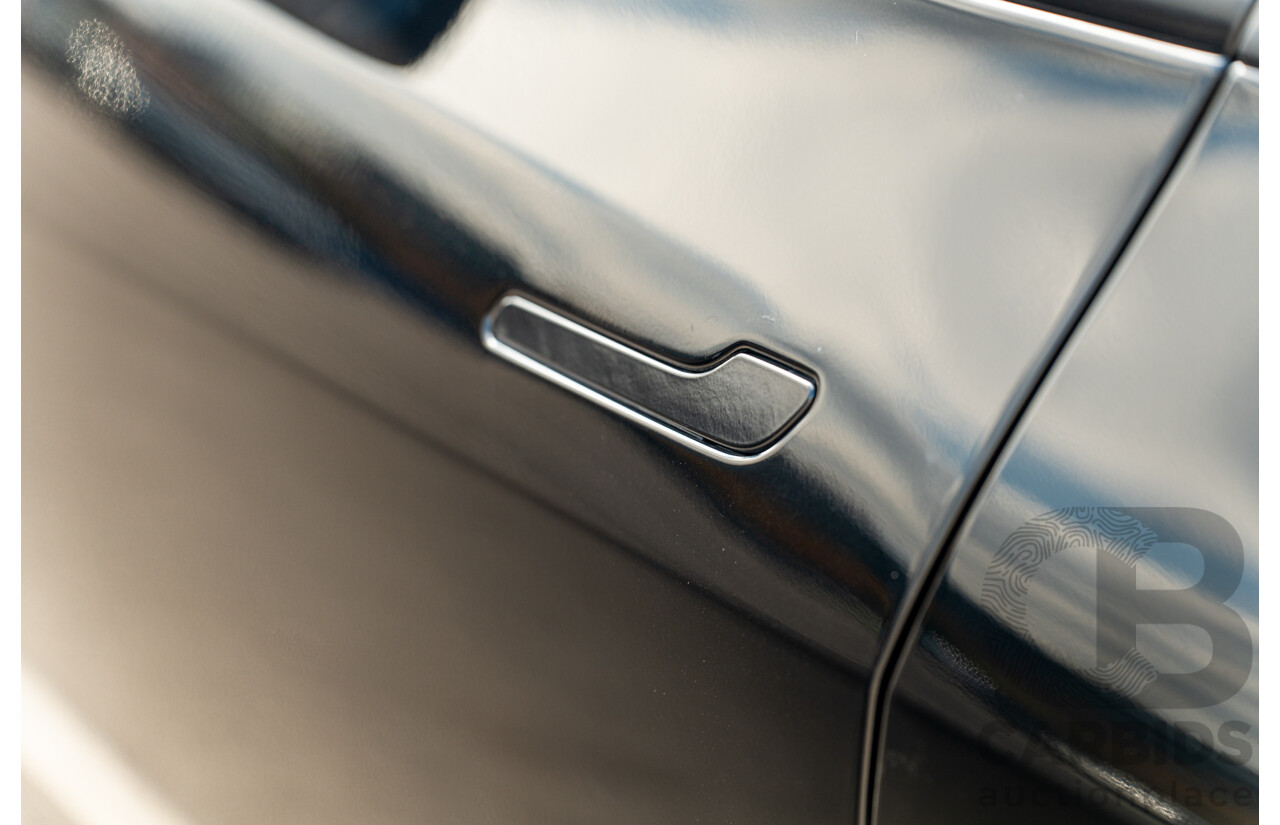 07/2023 Tesla Model Y Rear Wheel Drive 4d Wagon Solid Black Dedicated Electric EV 220kw