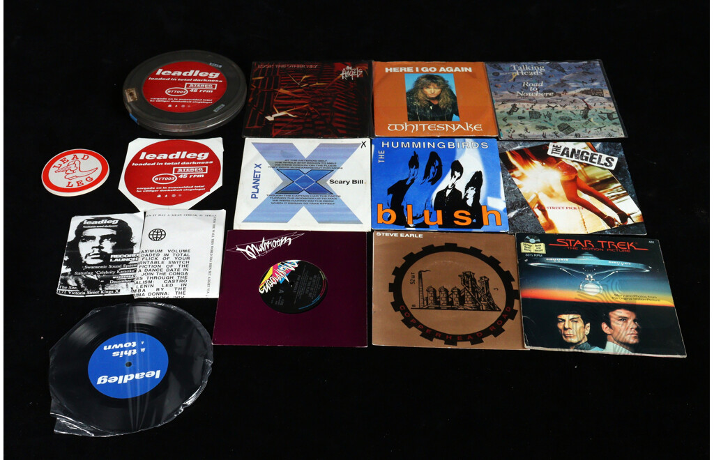 Collection Ten Seven Inch 45RPM Singles Including Leadleg in Film Tin, Three the Angels Examples, Steve Earl Copperhead Road, Talking Heads and More