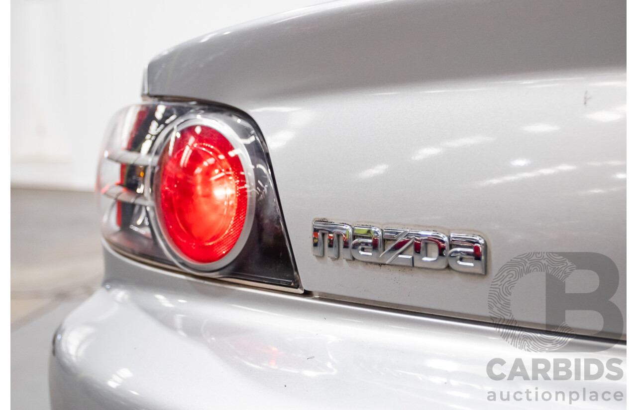9/2005 Mazda RX-8 FE Series 1 4d Coupe Sunlight Silver Metallic 1.3L