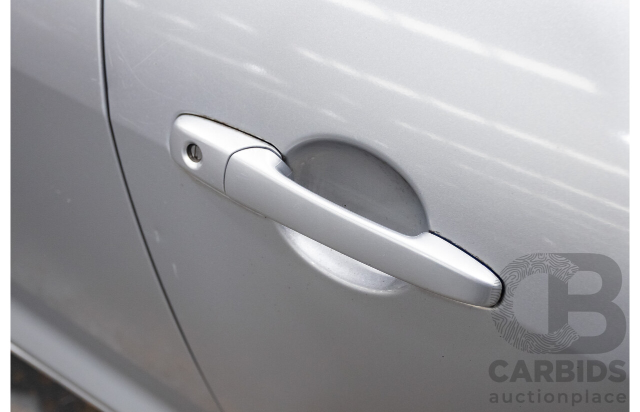 9/2005 Mazda RX-8 FE Series 1 4d Coupe Sunlight Silver Metallic 1.3L