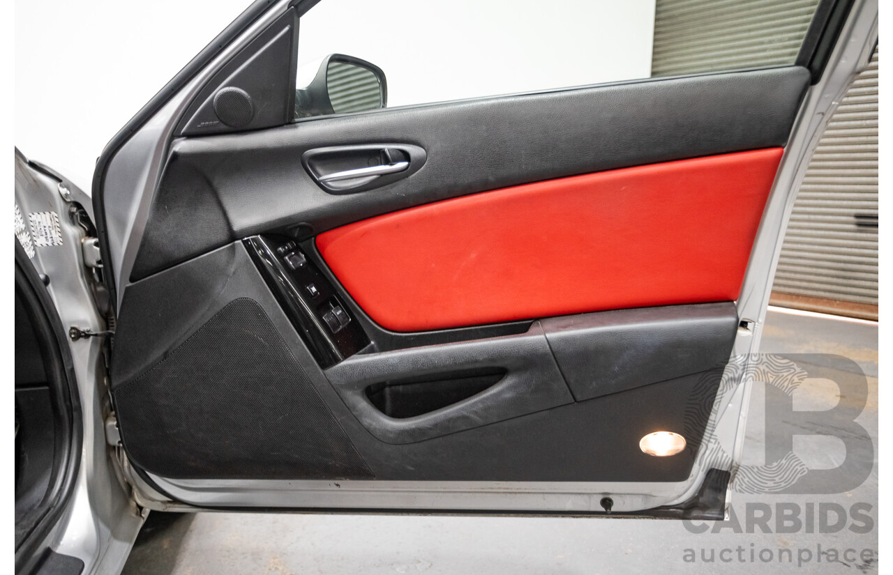 9/2005 Mazda RX-8 FE Series 1 4d Coupe Sunlight Silver Metallic 1.3L