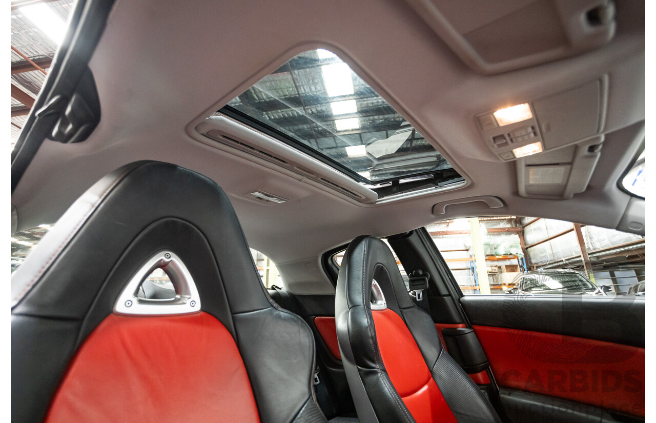 9/2005 Mazda RX-8 FE Series 1 4d Coupe Sunlight Silver Metallic 1.3L