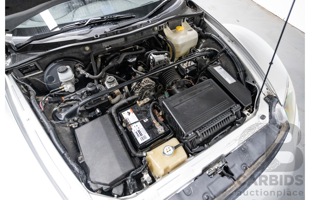 9/2005 Mazda RX-8 FE Series 1 4d Coupe Sunlight Silver Metallic 1.3L