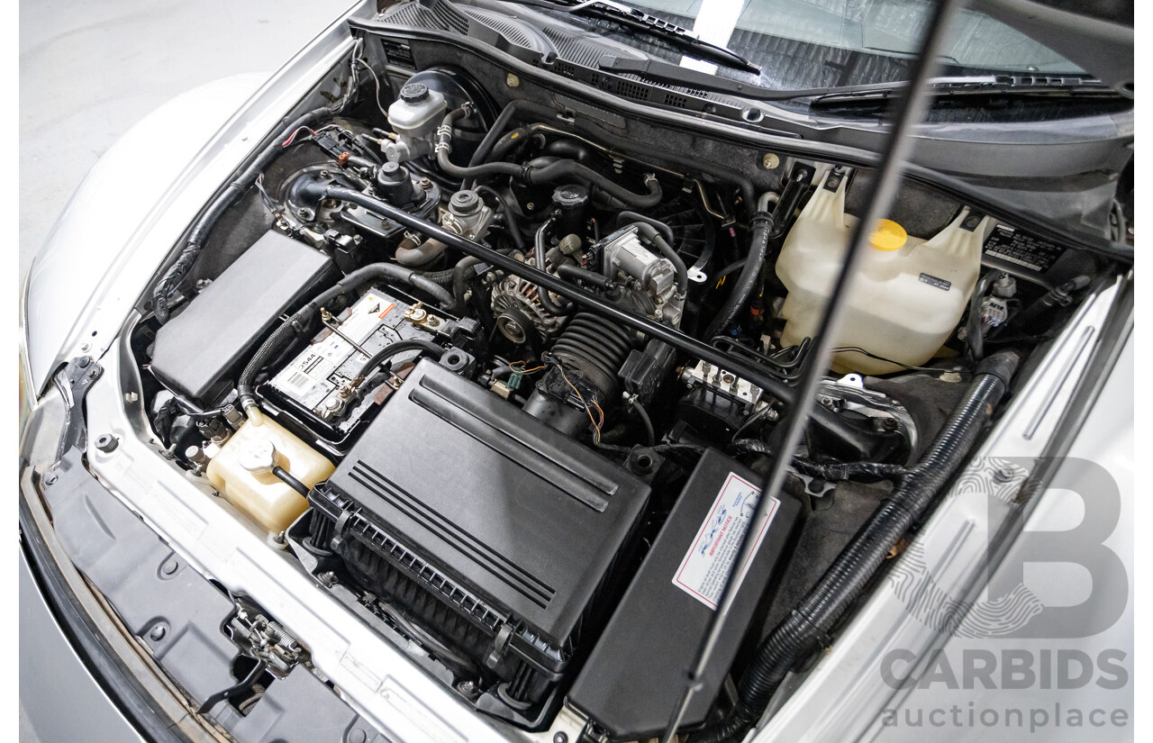 9/2005 Mazda RX-8 FE Series 1 4d Coupe Sunlight Silver Metallic 1.3L