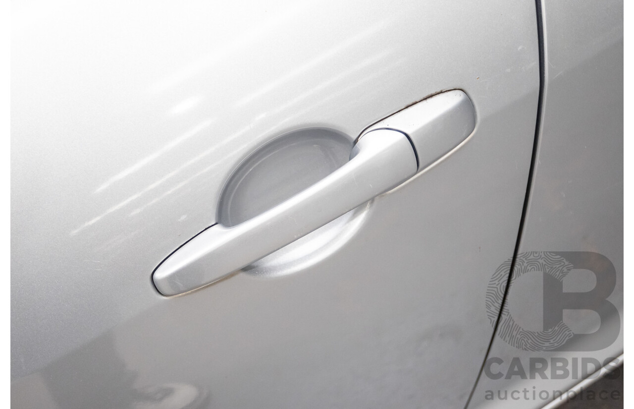 9/2005 Mazda RX-8 FE Series 1 4d Coupe Sunlight Silver Metallic 1.3L