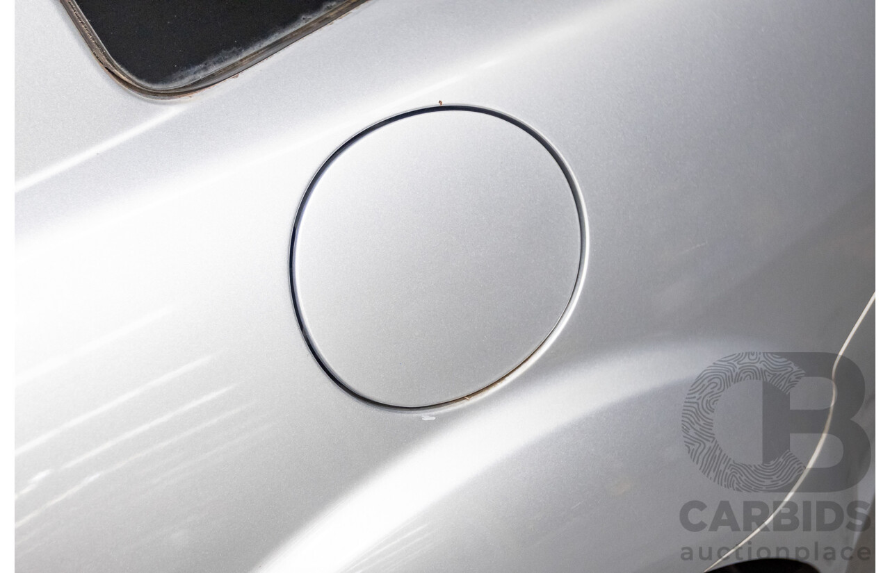 9/2005 Mazda RX-8 FE Series 1 4d Coupe Sunlight Silver Metallic 1.3L