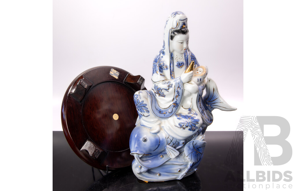 Vintage Chinese Hand Painted Porcelain Guan Yin Riding Koi with Child Figure on Lotus Base with Gilt Highlights on Wooden Base