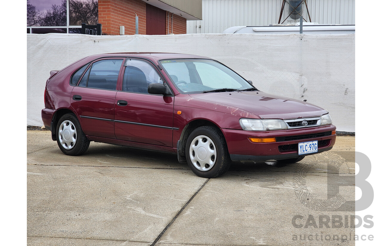 5/1999 Toyota Corolla Conquest SECA AE102R 5d Liftback Maroon 1.8L