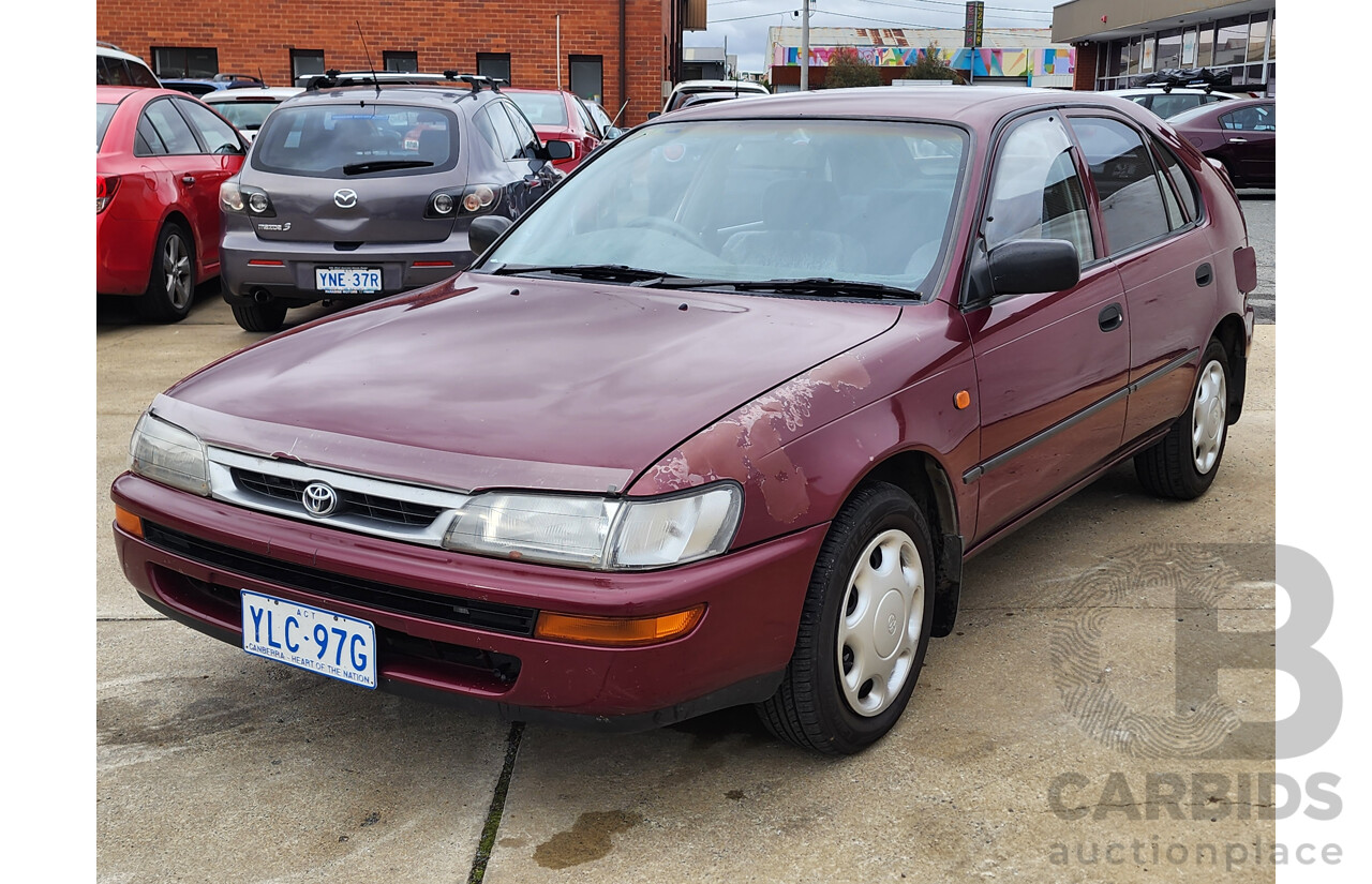 5/1999 Toyota Corolla Conquest SECA AE102R 5d Liftback Maroon 1.8L