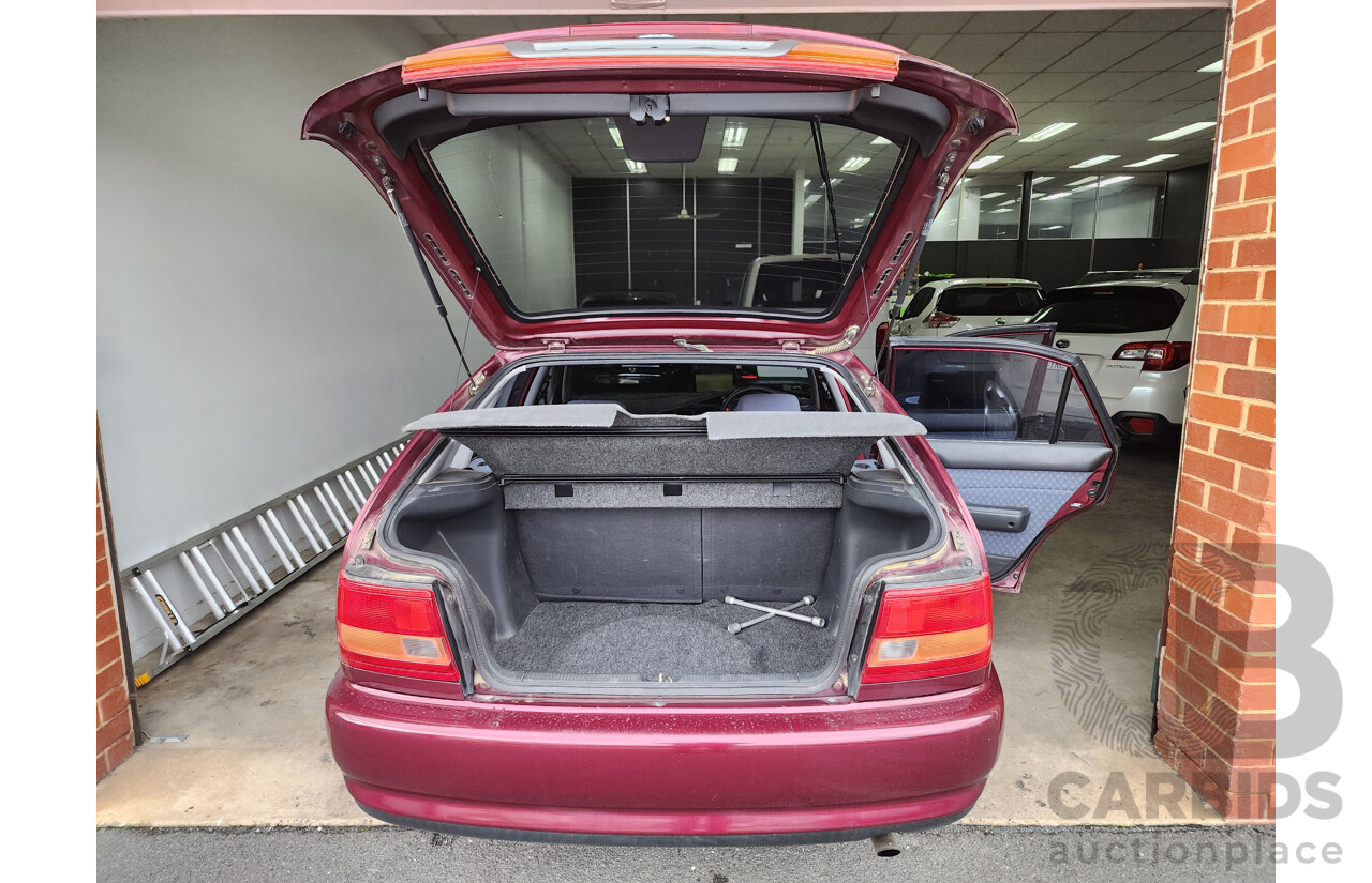 5/1999 Toyota Corolla Conquest SECA AE102R 5d Liftback Maroon 1.8L