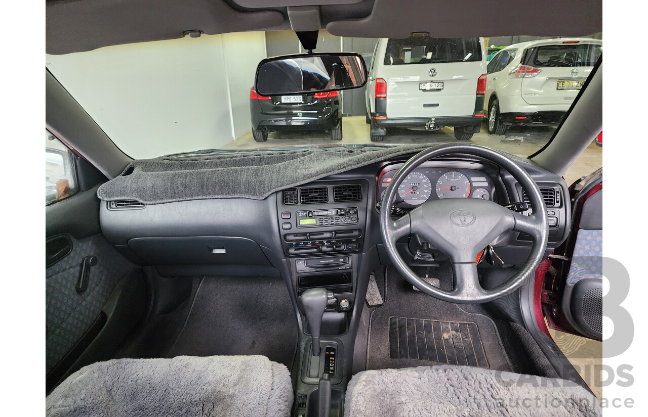 5/1999 Toyota Corolla Conquest SECA AE102R 5d Liftback Maroon 1.8L