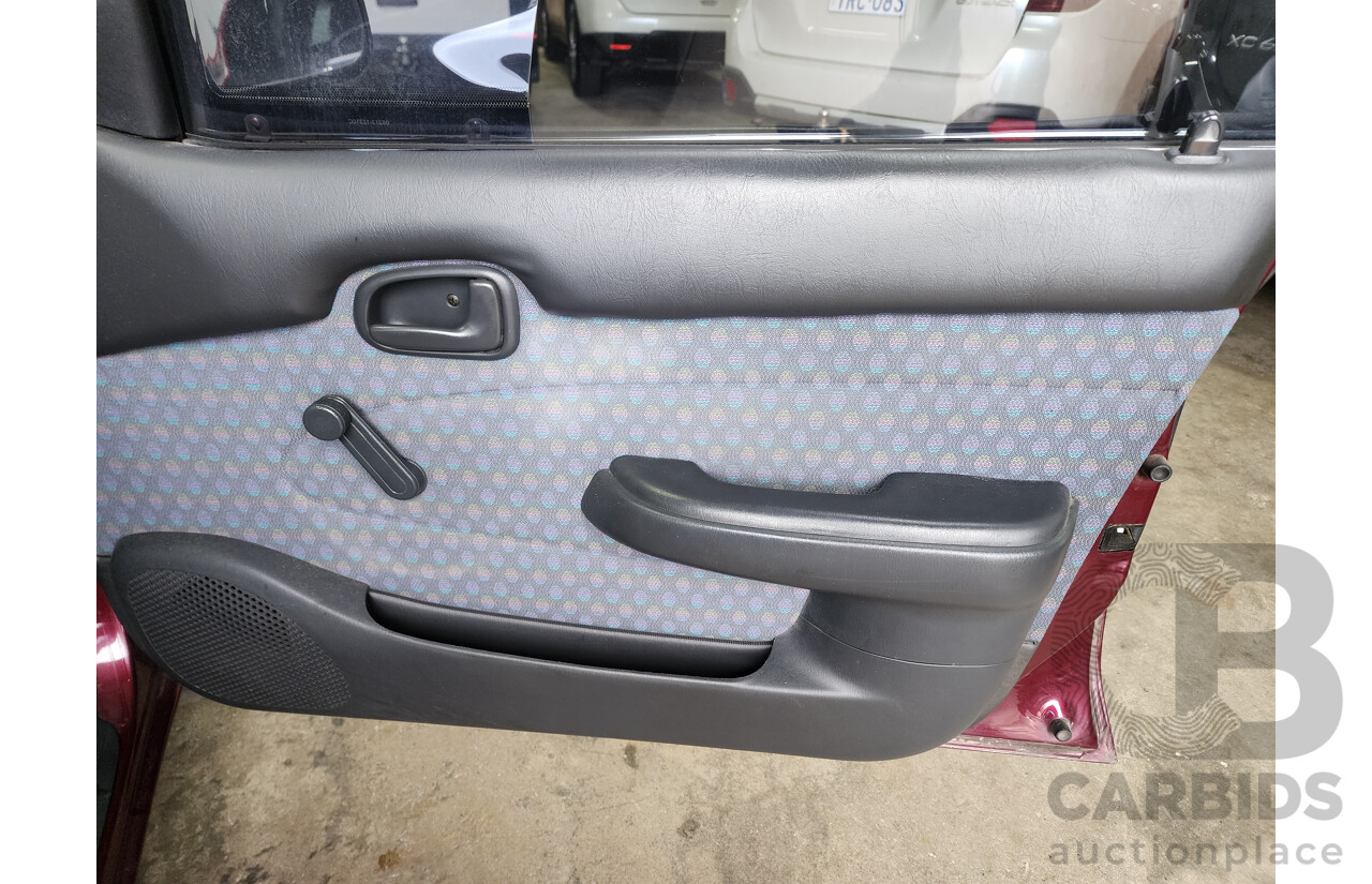 5/1999 Toyota Corolla Conquest SECA AE102R 5d Liftback Maroon 1.8L