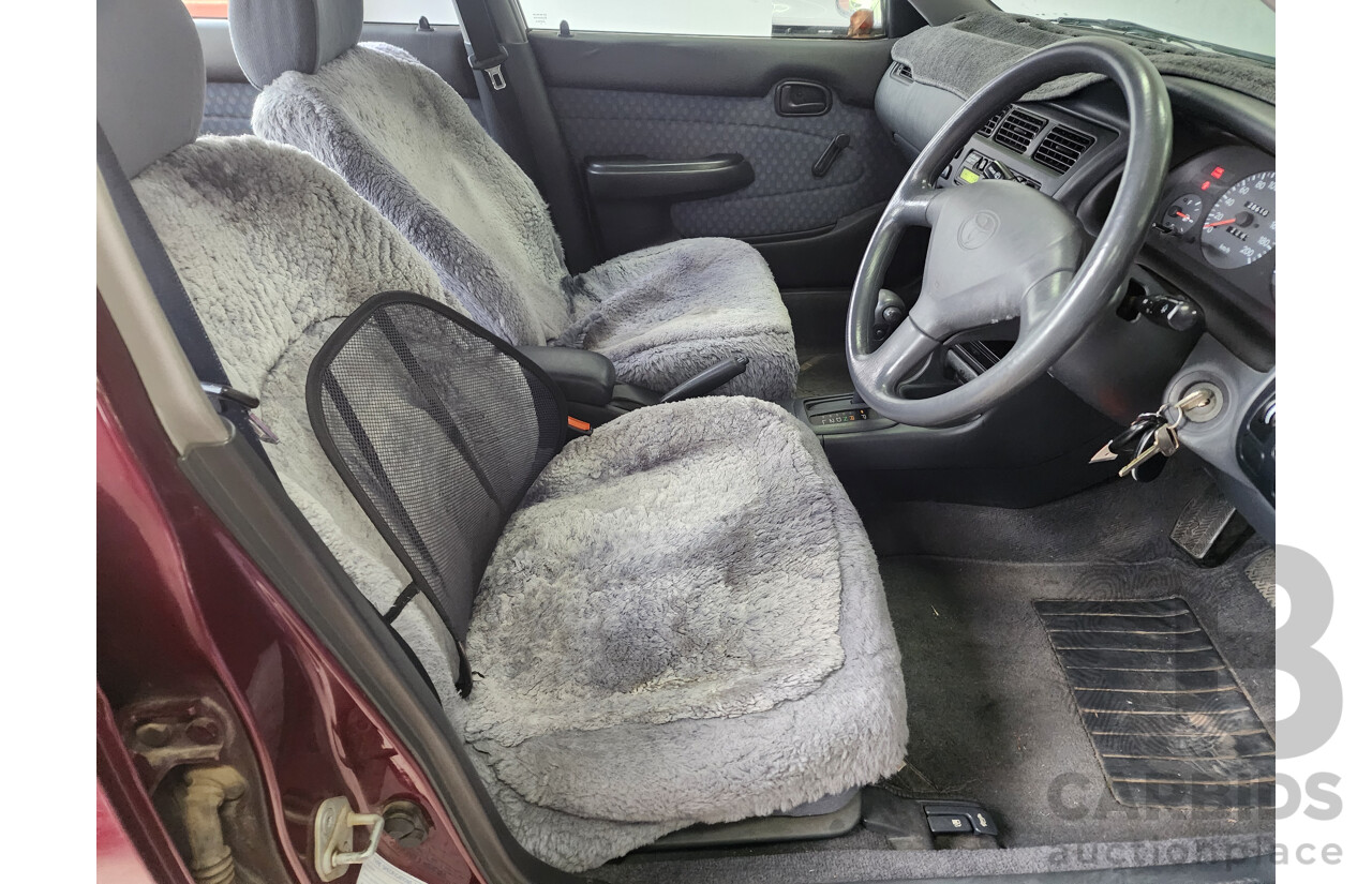 5/1999 Toyota Corolla Conquest SECA AE102R 5d Liftback Maroon 1.8L