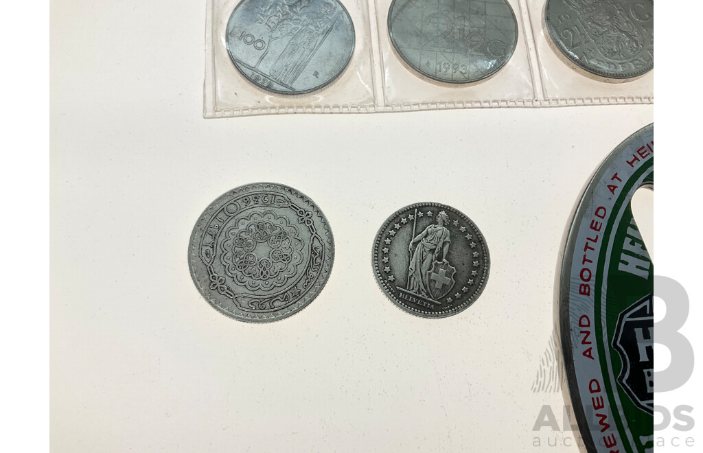 Syria 1936 Silver Fifty Piastres Coin, Switzerland 1944 Silver One Franc, Italy 1975, 1979 One Hundred Lire, Netherlands 1972, 1993 Two and Half Gulden, France 1949 Two Francs,  Heineken Bottle Opener