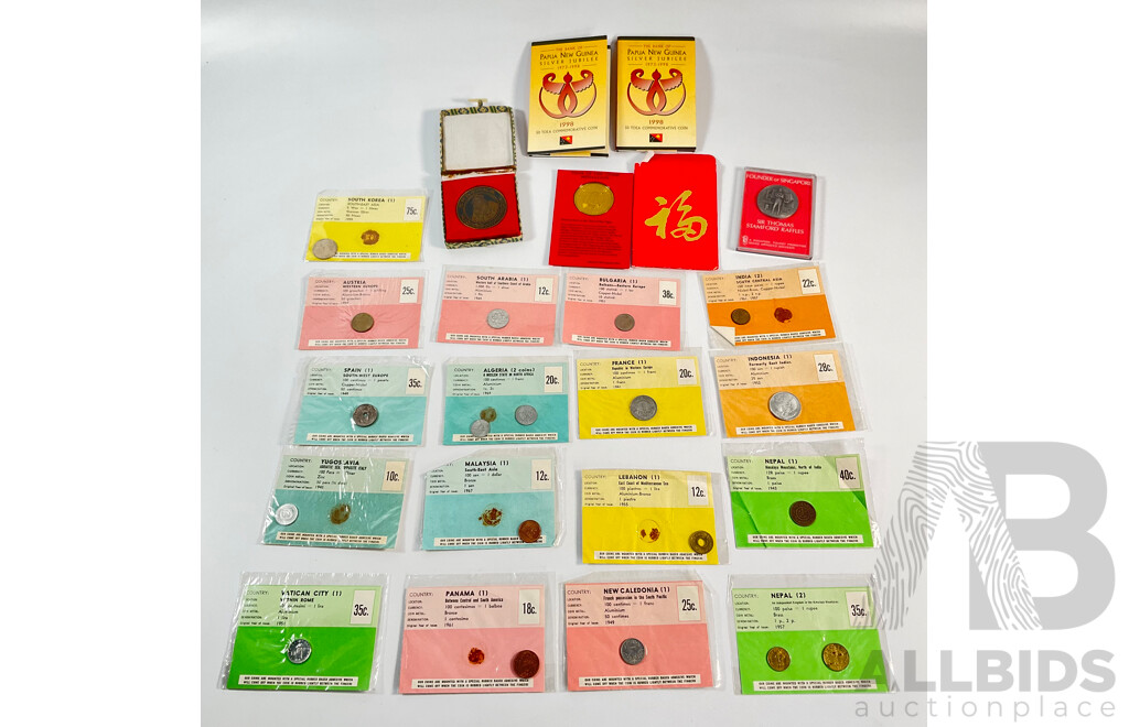 Collection of Vintage International Carded Coins, Chinese Confucius Medallion Two Singapore Sir Thomas Raffles Medallions, Two Papua New Guinea 1998 Fifty Toea Coins, Bank of PNG Silver Jubilee