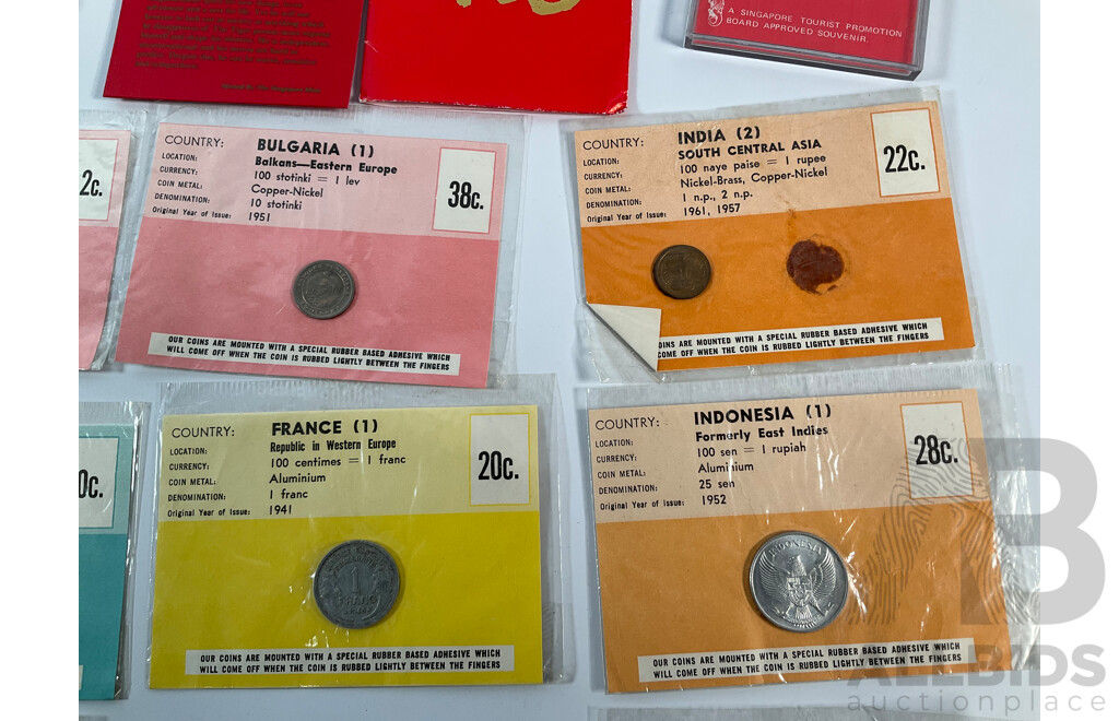 Collection of Vintage International Carded Coins, Chinese Confucius Medallion Two Singapore Sir Thomas Raffles Medallions, Two Papua New Guinea 1998 Fifty Toea Coins, Bank of PNG Silver Jubilee