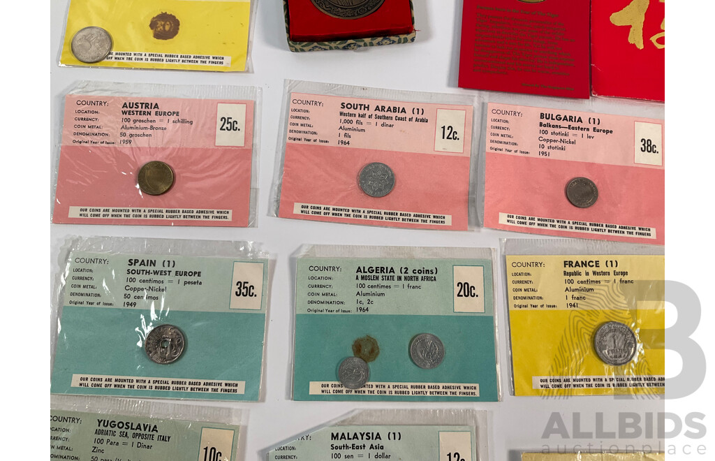 Collection of Vintage International Carded Coins, Chinese Confucius Medallion Two Singapore Sir Thomas Raffles Medallions, Two Papua New Guinea 1998 Fifty Toea Coins, Bank of PNG Silver Jubilee